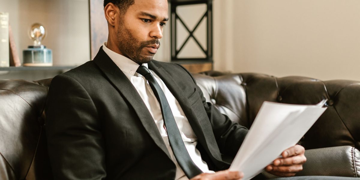 A person confidently reviewing important documents, reflecting understanding legal aspects of renting in the UAE.