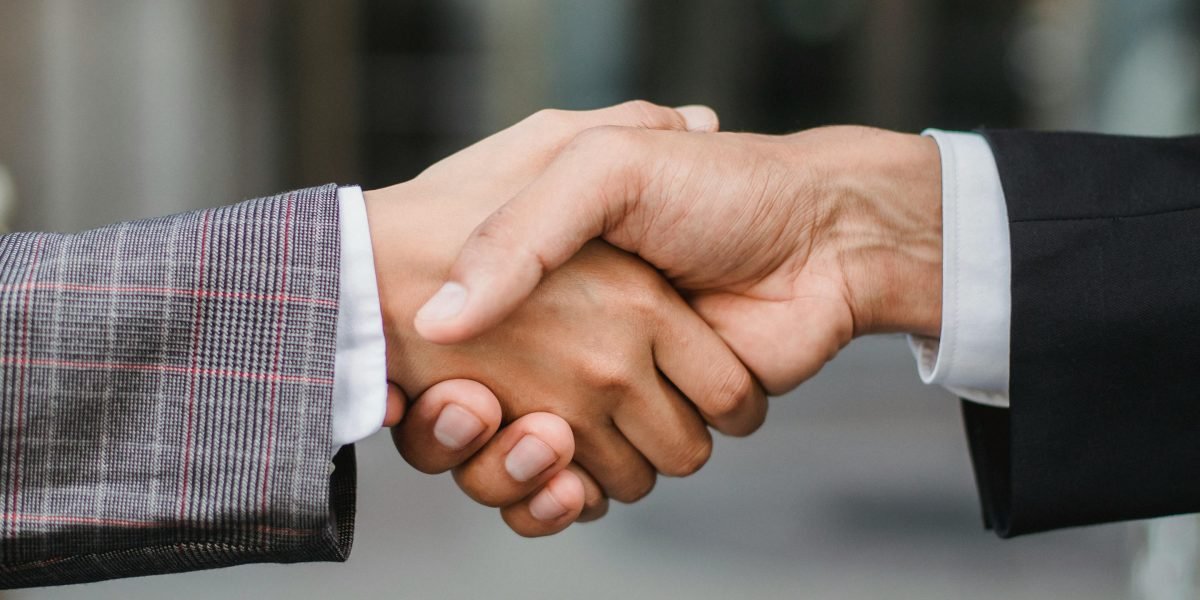 A professional discussion symbolizing the importance of trust and regulation in real estate transactions.