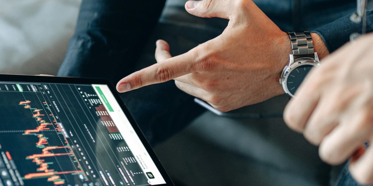 A person reviewing financial data to understand market performance and potential returns on real estate investment.
