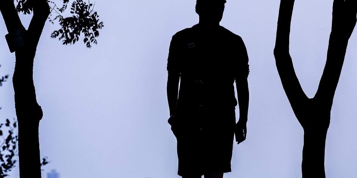 A person looking at a city skyline, ready to make a confident decision about property investment.