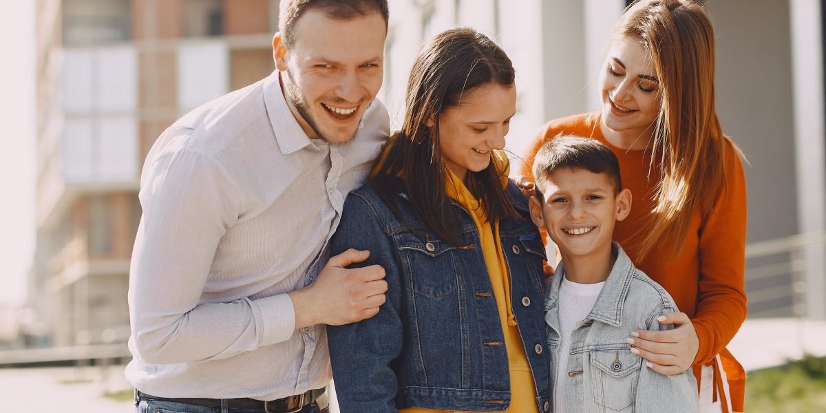 A family enjoying green spaces in a newly developed master-planned community.
