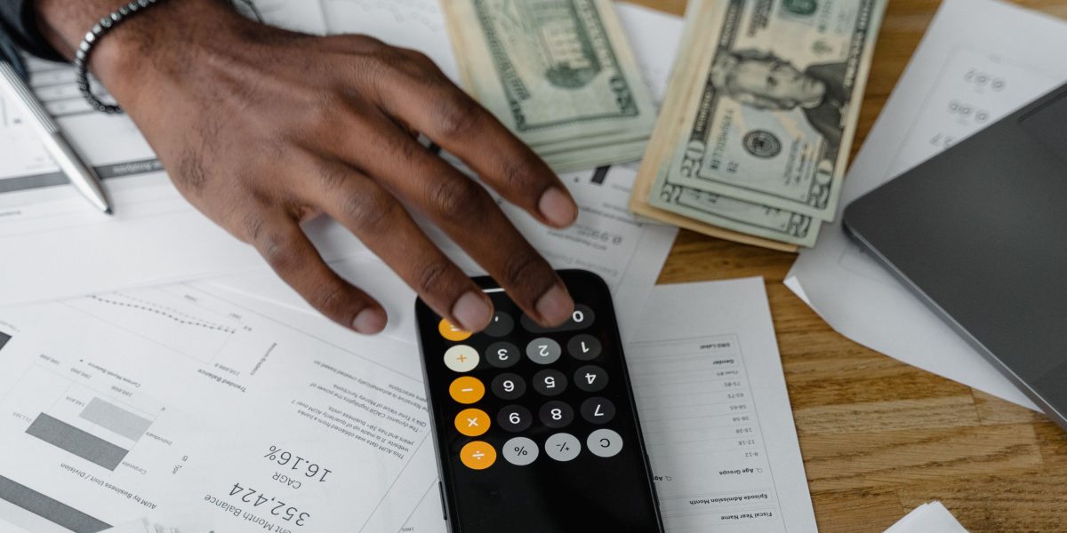 An individual thoughtfully reviewing options, reflecting the decision-making process for a significant investment.