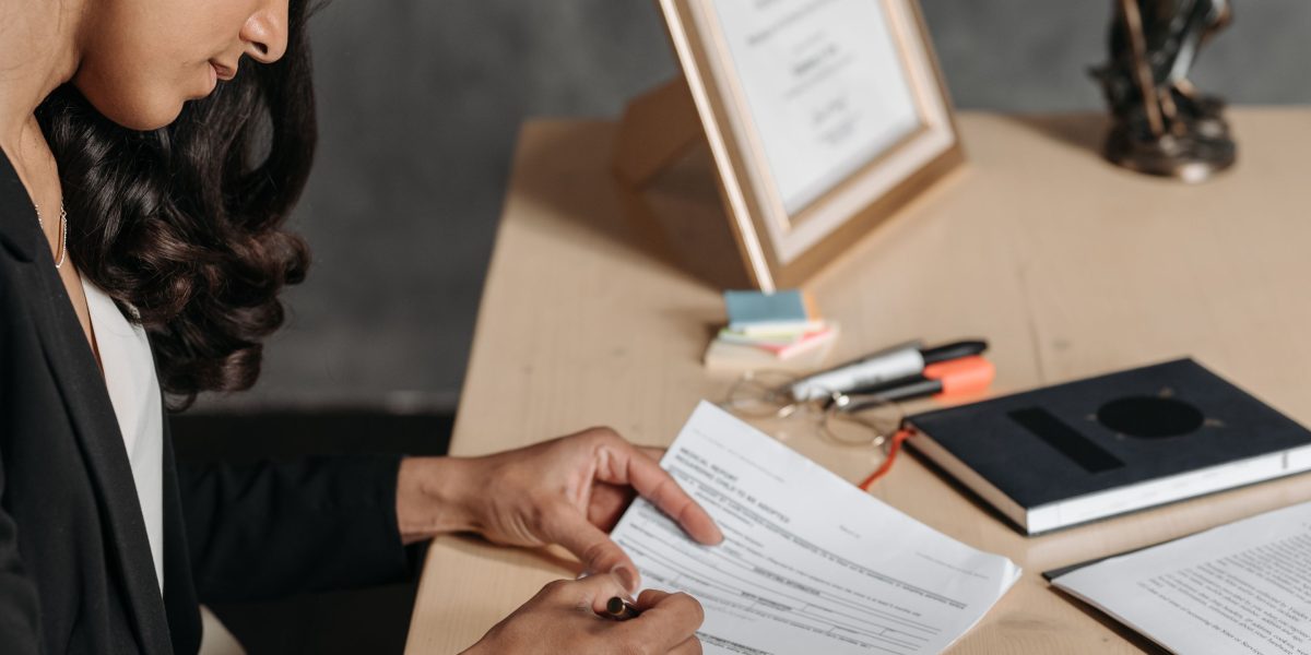 A buyer meticulously reviewing legal and project documents, emphasizing the importance of due diligence.