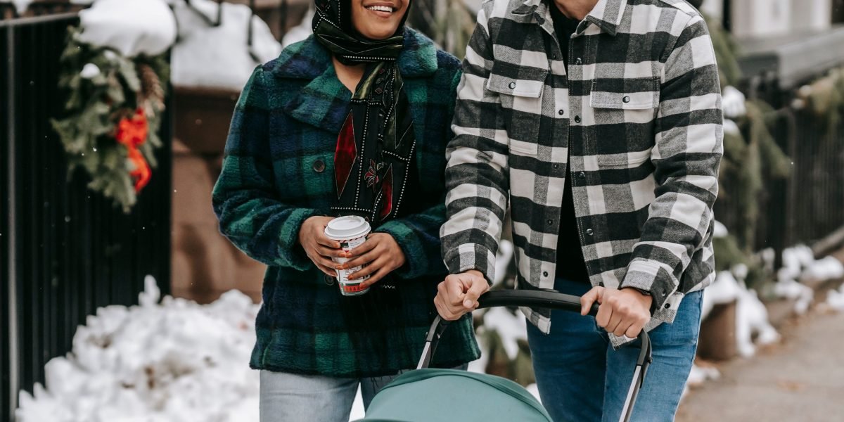 A happy family enjoys a stroll through a beautiful, upscale neighborhood, embodying the ideal lifestyle curation.