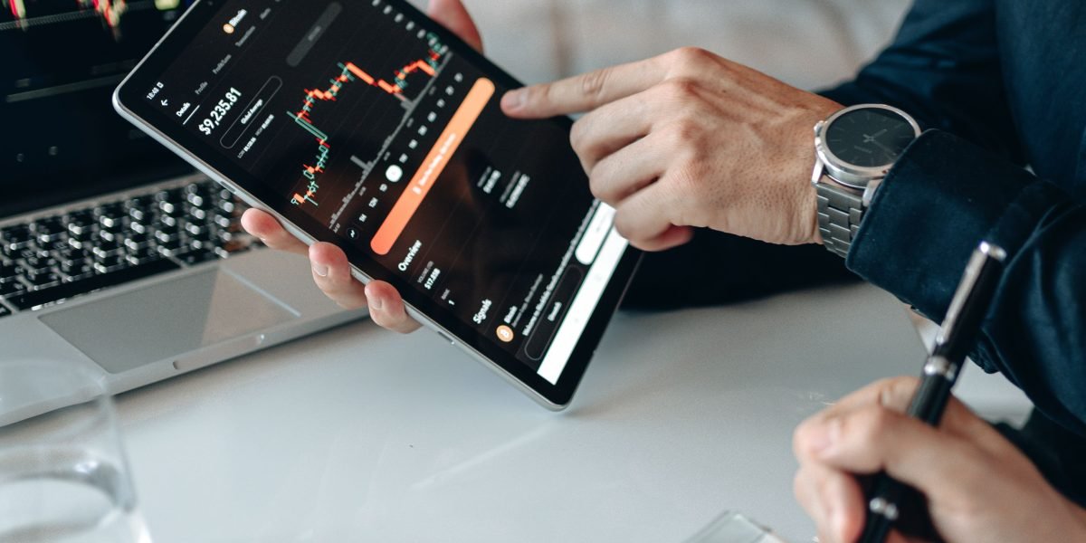 An investor reviews various property options, weighing lifestyle considerations against potential return on investment.