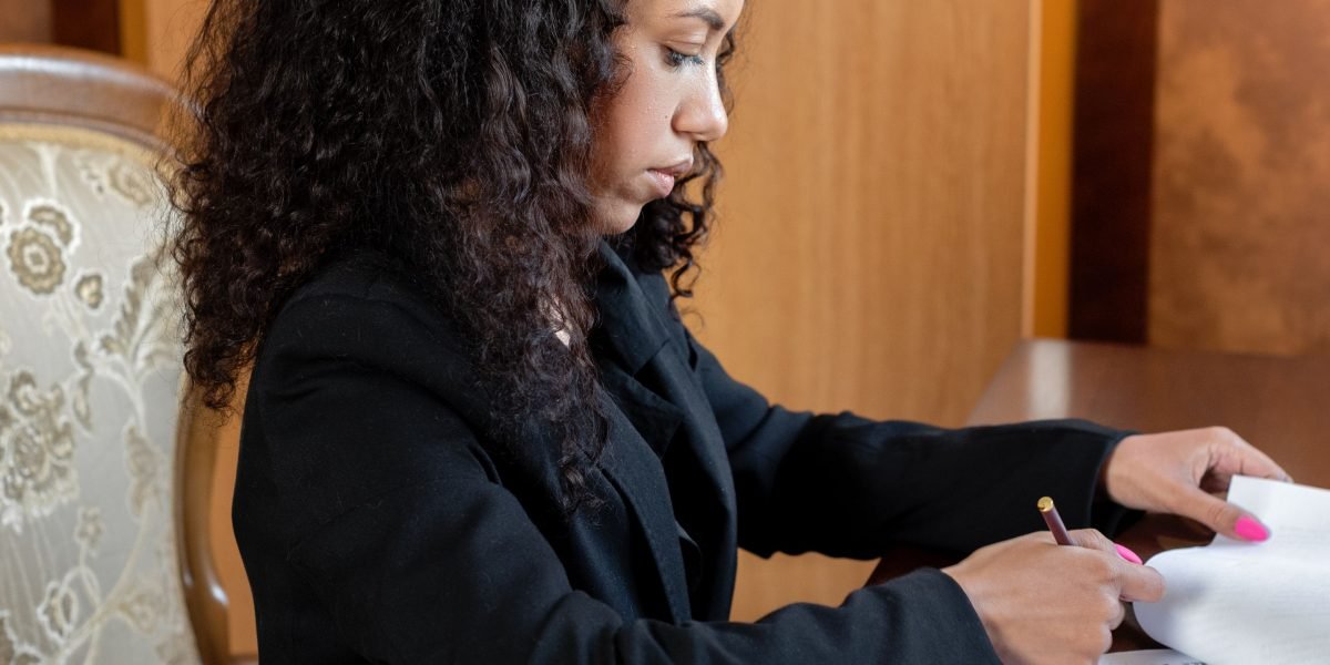 A person carefully examining important legal papers related to tenant rights and rental agreements.