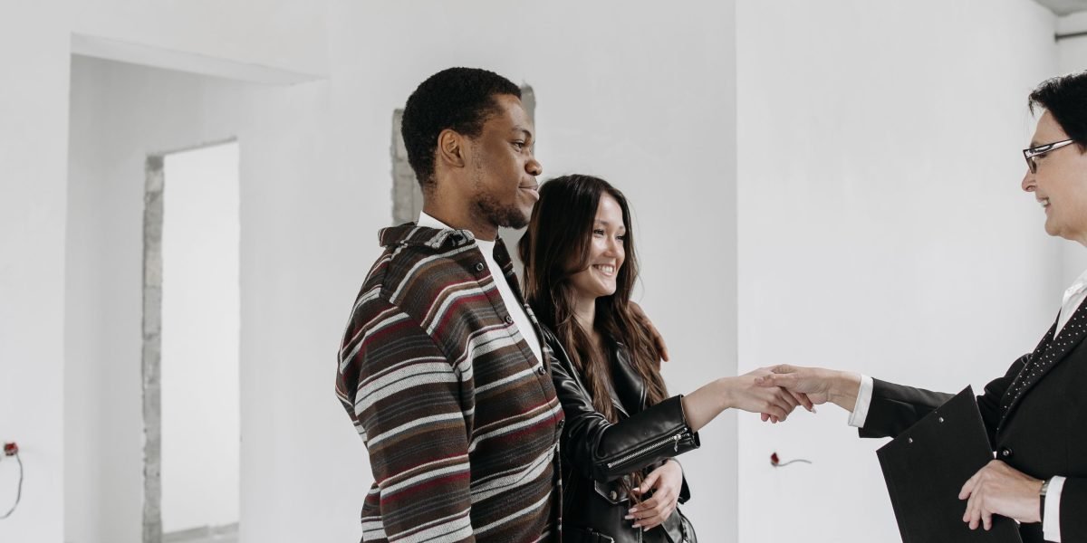 A client and a real estate agent conclude a successful meeting, signifying trust and partnership.