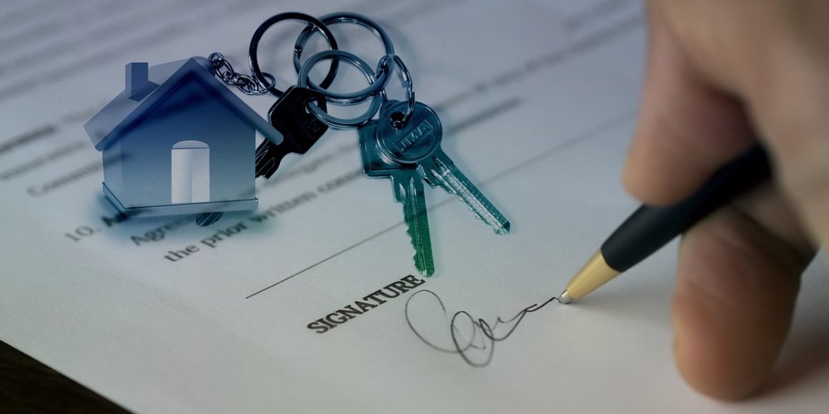 A real estate professional explaining property plans and details to a client, emphasizing transparent communication.
