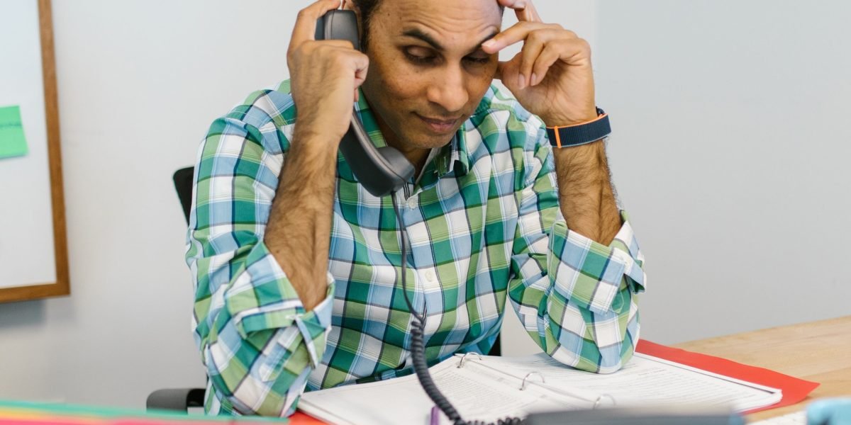 A potential investor or buyer feeling swamped by a deluge of real estate information, struggling to make a decision.