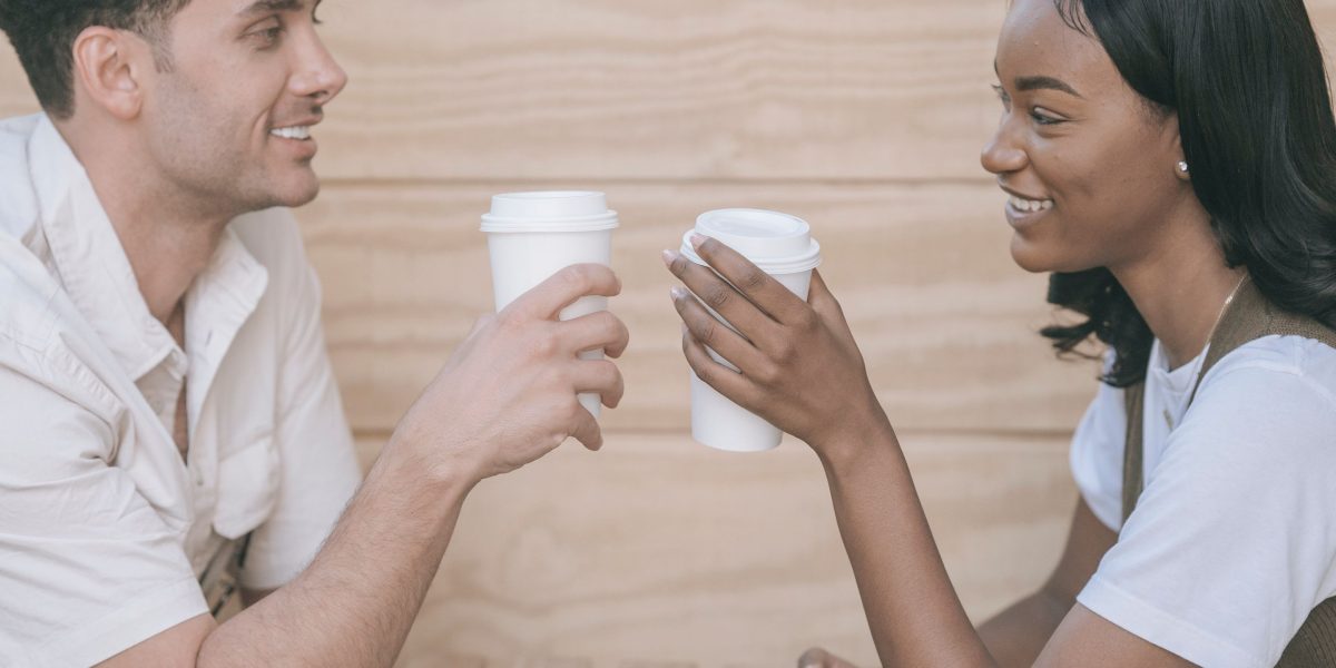 Friends enjoying coffee together at an outdoor cafe, reflecting the vibrant and social lifestyle available in Al Barsha.