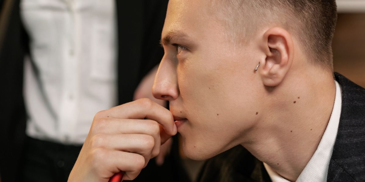 A person thoughtfully considering important financial and lifestyle decisions for their future.