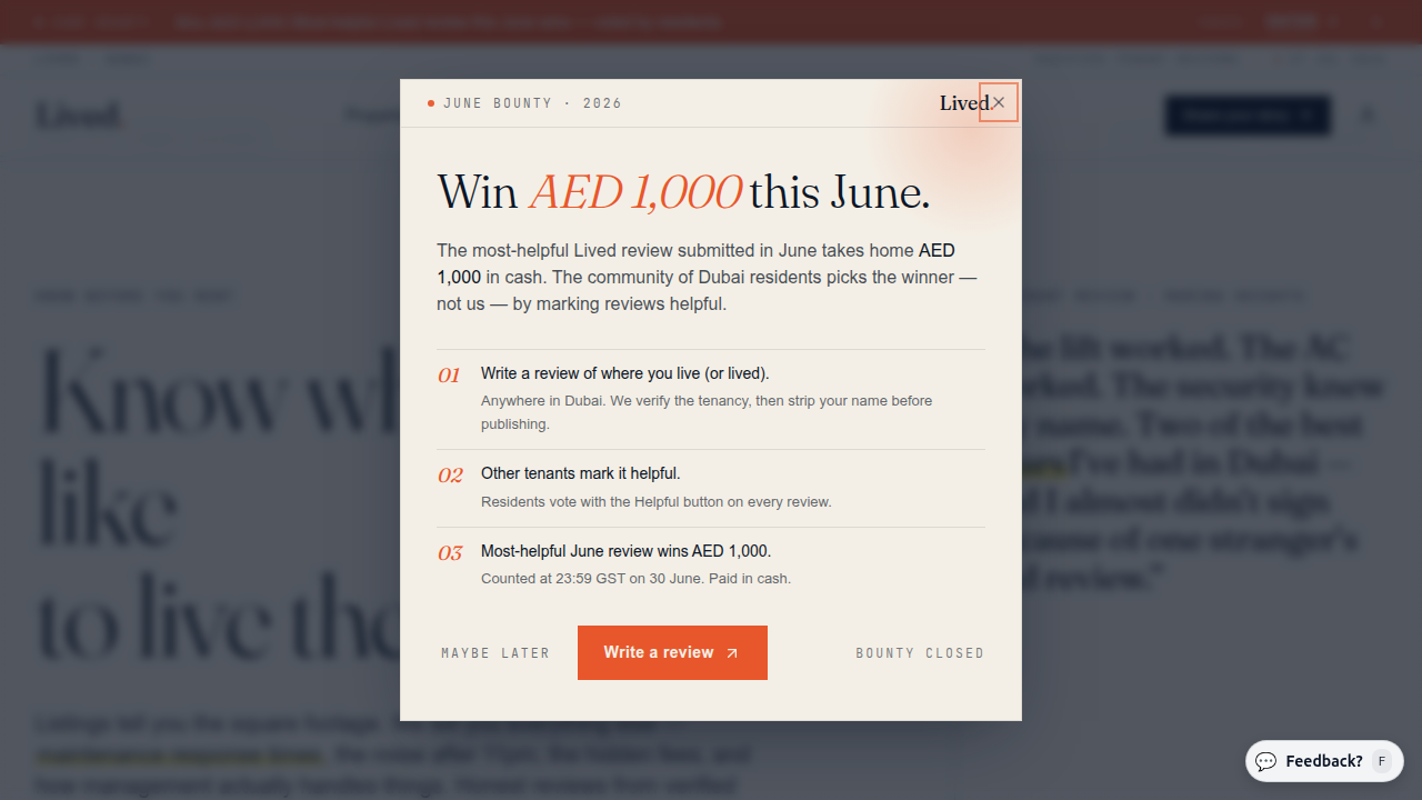 A screenshot of the Lived.ae website, a platform for tenant reports and community reviews in Dubai.