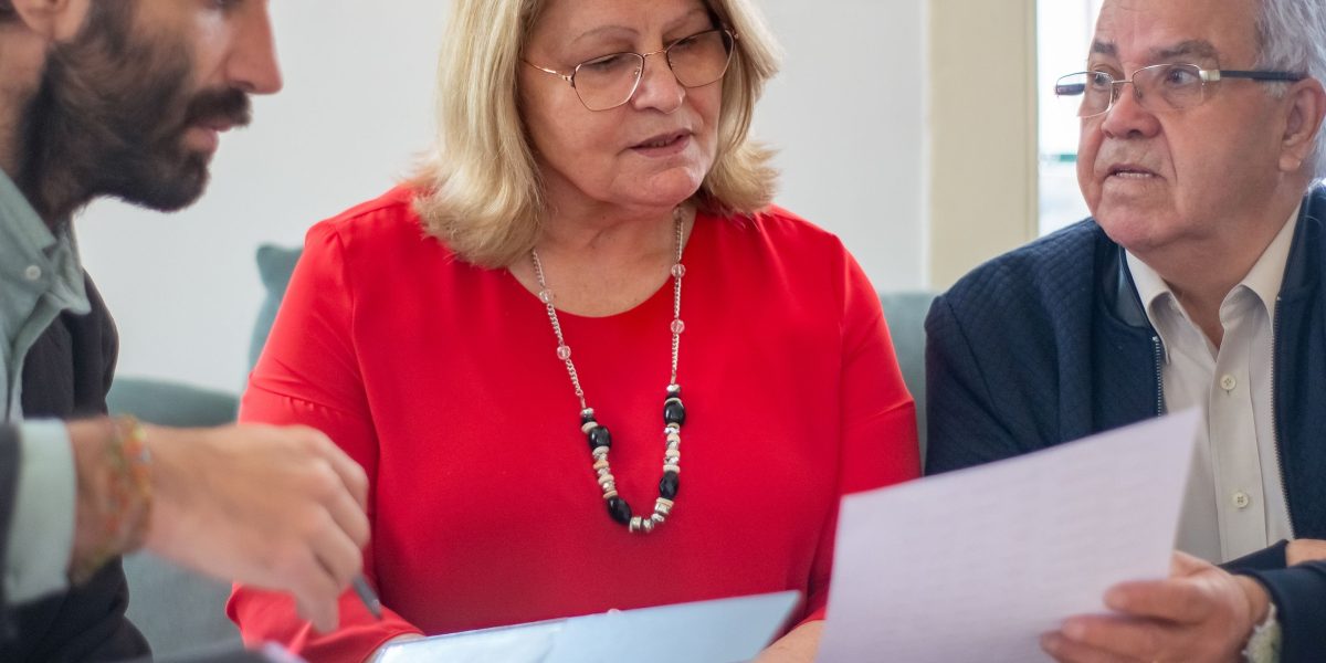 A financial advisor details mortgage options and payment plans to a prospective property buyer.