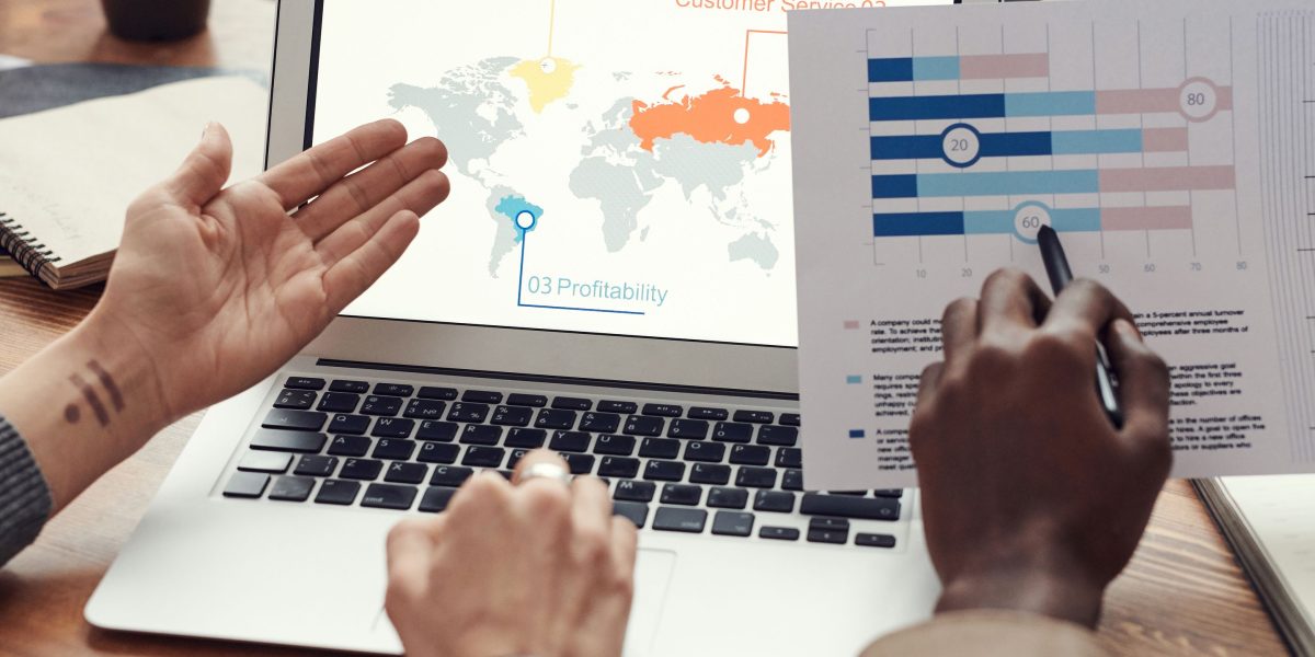 Professionals collaborating to analyze property listings using advanced filters and research tools for precise results.