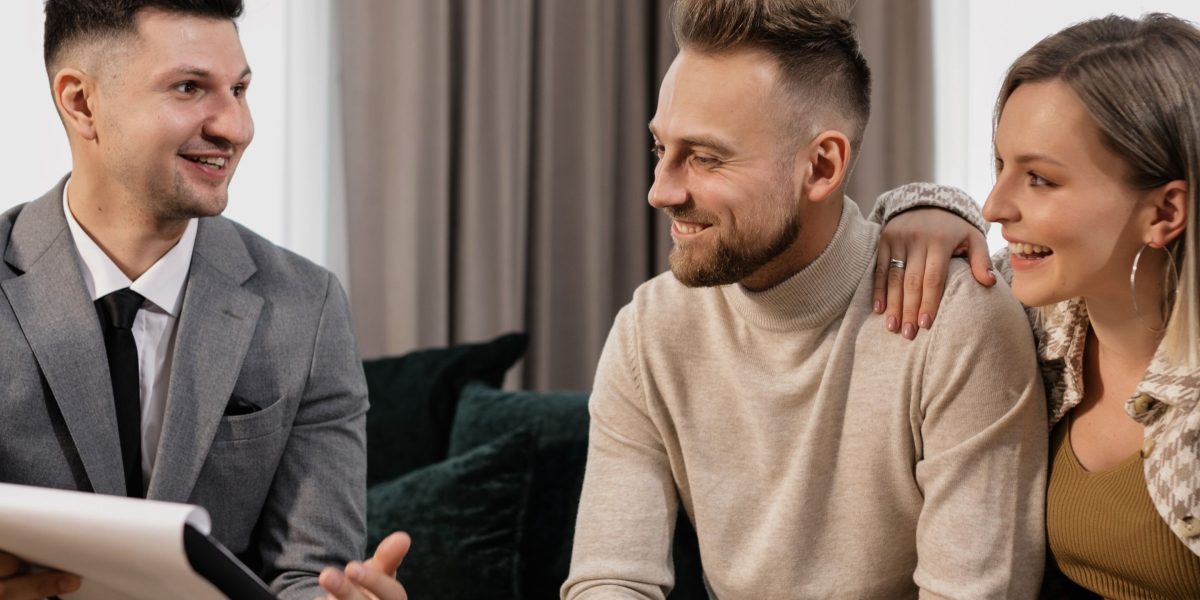 A couple discusses the pros and cons of off-plan versus ready properties with a real estate expert.
