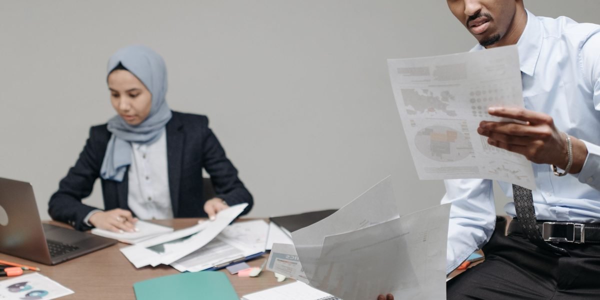 A team of professionals meticulously reviews architectural plans and design documents to evaluate property rarity.
